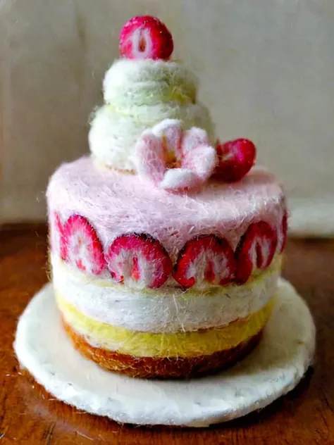 a close up of a cake with strawberries on top of it